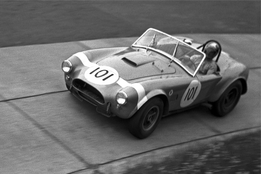 Bob Bondurant driving an AC Cobra at the Nürburgring in 1964